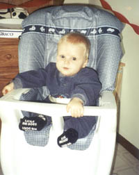 Justin in a high chair